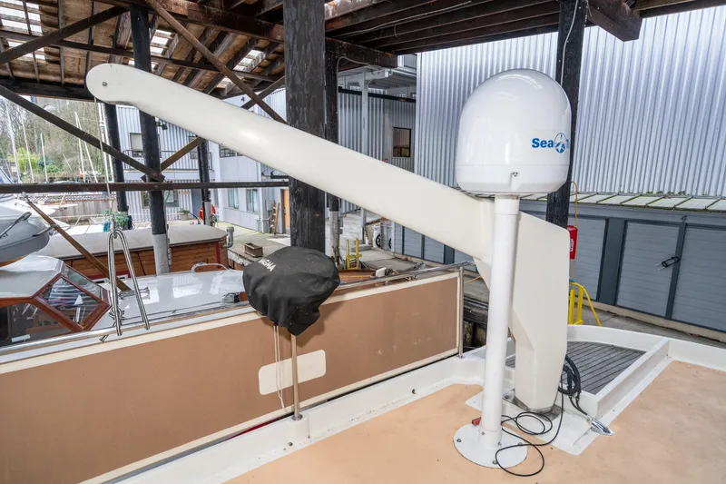 Slide: The Image of 1973 American Marine Alaskan 53 yacht with radar equipment in a boatyard. - 56