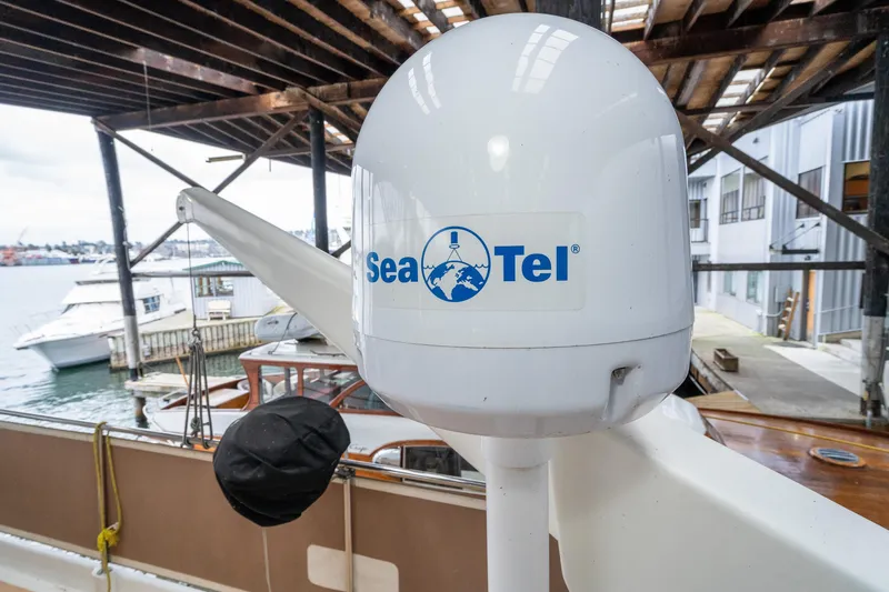 Slide: The Image of Sea Tel satellite on 1973 American Marine Alaskan 53 yacht docked at marina. - 59