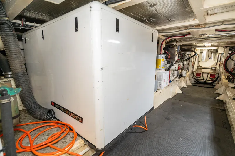 Slide: The Image of Engine room of a 1973 American Marine Alaskan 53 yacht, featuring Northern Lights generator. - 73