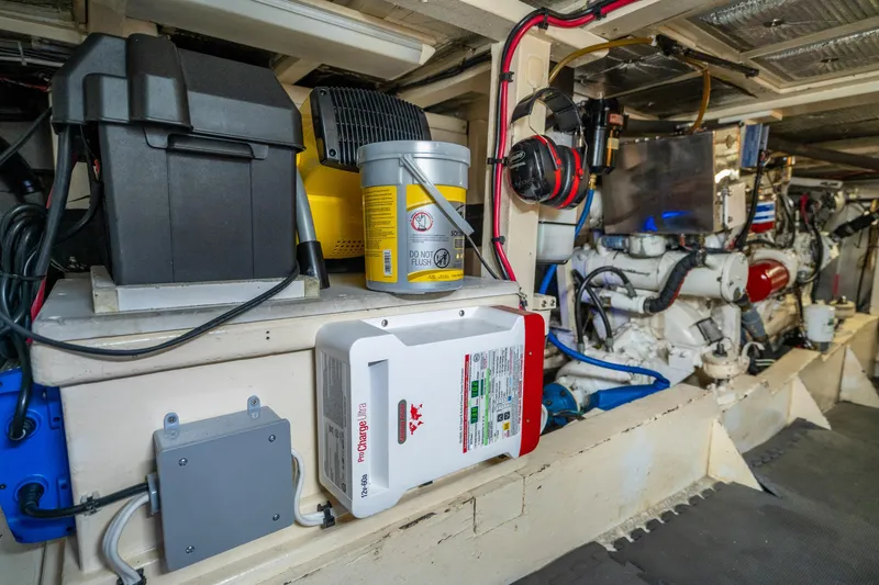 Slide: The Image of Engine room of 1973 American Marine Alaskan 53 yacht, showcasing equipment and machinery. - 75