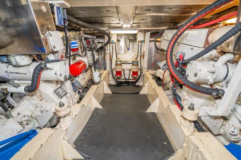 Slide: The Image of Engine room of a 1973 American Marine Alaskan 53 yacht, showcasing mechanical components. - 76
