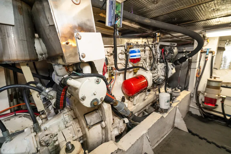 Slide: The Image of Engine room of a 1973 American Marine Alaskan 53 yacht, showcasing mechanical components. - 78