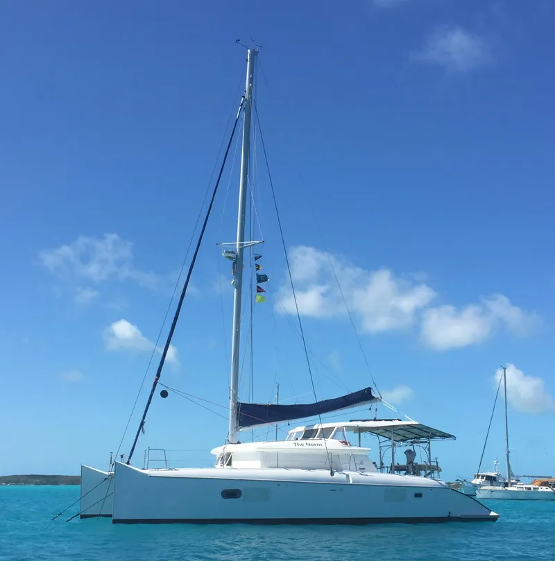Slide: The Image of 2007 Lagoon 420 catamaran on calm waters under a blue sky. - 1