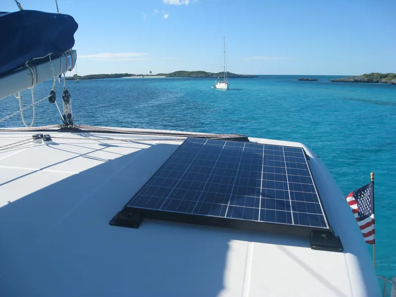 Slide: The Image of Lagoon 420 catamaran with solar panel on blue water, year 2007. - 15