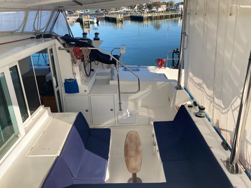 Slide: The Image of Interior of a 2007 Lagoon 420 yacht with blue seating cushions. - 19