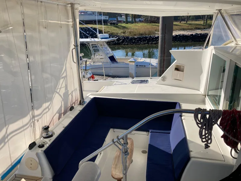 Slide: The Image of Interior of a 2007 Lagoon 420 yacht with blue seating cushions. - 20