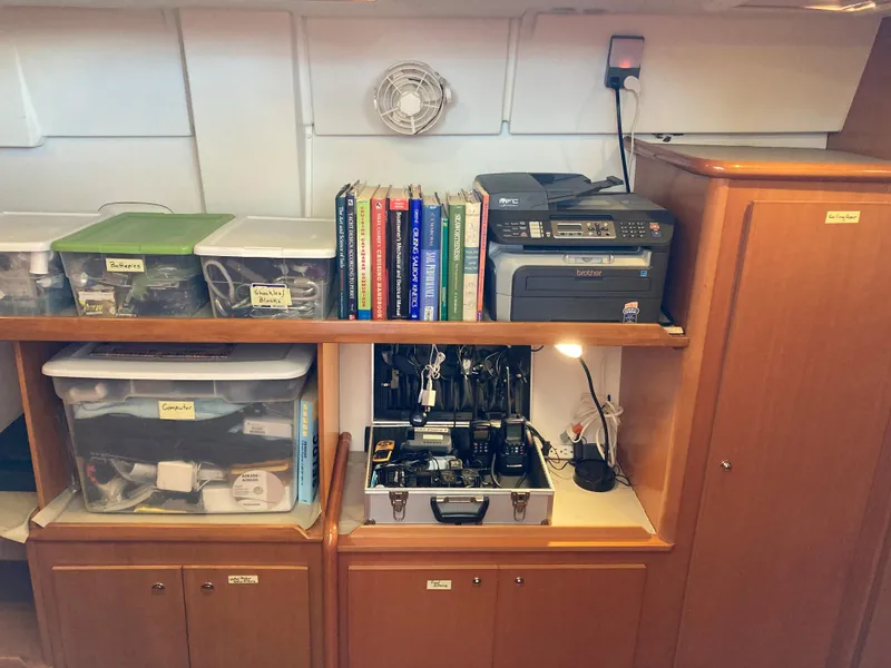 Slide: The Image of Lagoon 420 yacht interior with books and electronics. - 27