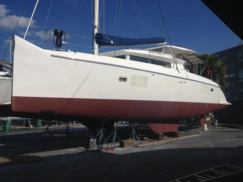 Slide: The Image of 2007 Lagoon 420 catamaran on dry dock. - 3