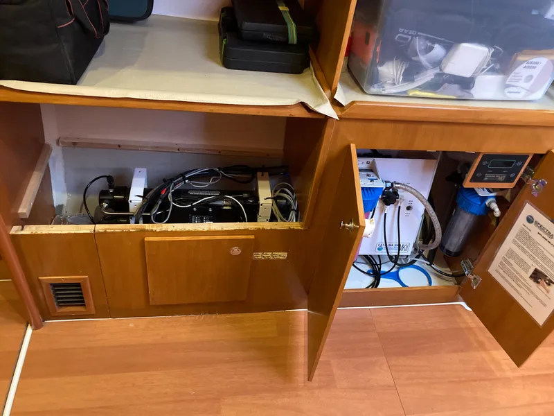 Slide: The Image of Lagoon 420 Yacht 2007, open cabinets with technical equipment. - 32