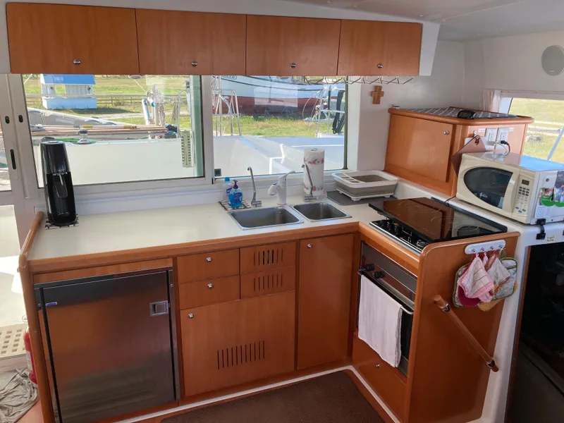Slide: The Image of Kitchen on Lagoon 420 catamaran, 2007 model, featuring modern amenities. - 36