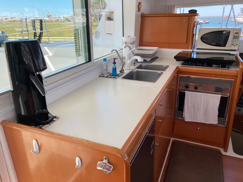 Slide: The Image of Lagoon 420 catamaran kitchen, 2007 model, featuring appliances and sink. - 38