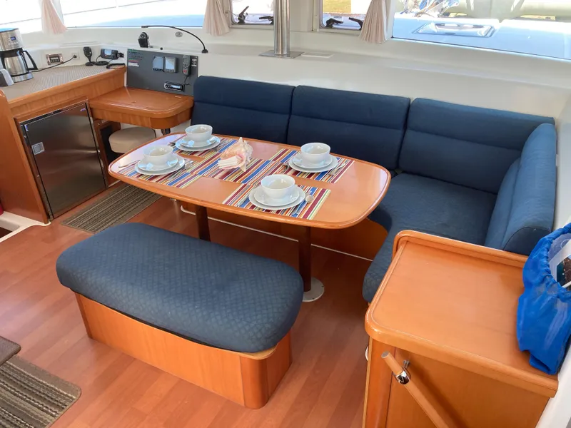 Slide: The Image of Interior of a 2007 Lagoon 420 yacht with dining table and seating area. - 40