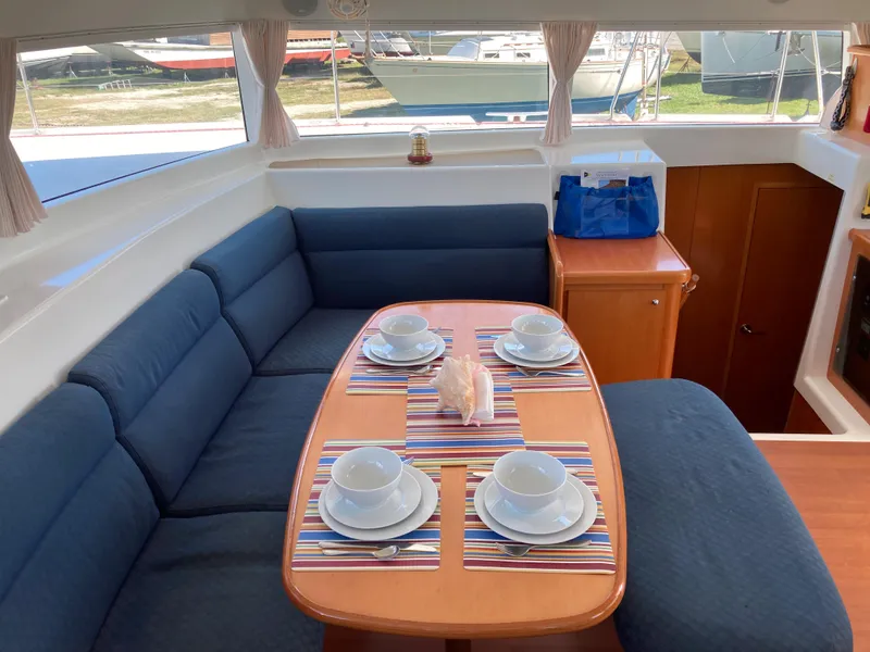 Slide: The Image of Interior of Lagoon 420 yacht, dining area with set table. - 41