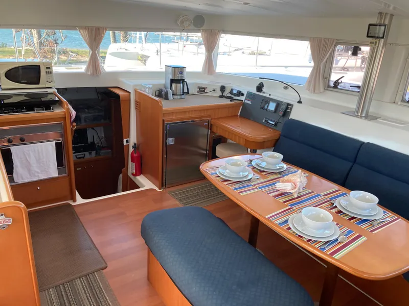 Slide: The Image of Interior of a 2007 Lagoon 420 yacht with dining area and kitchen. - 42