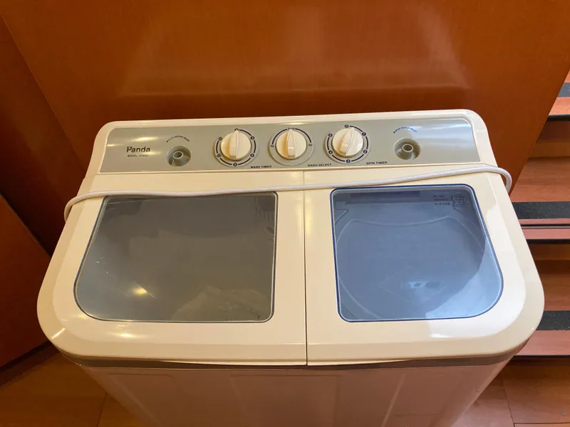 Slide: The Image of White washing machine with three dials, Lagoon 420 model, year 2007. - 46
