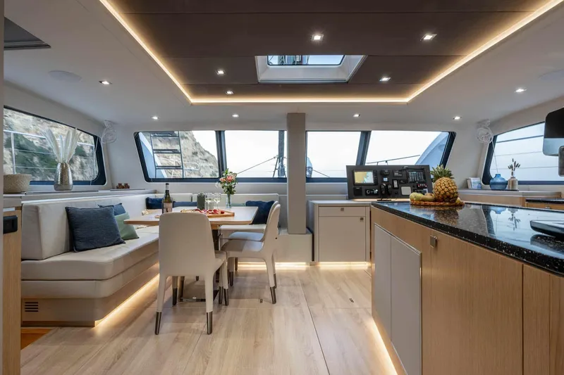 Slide: The Image of Luxurious interior of 2025 Privilege Signature 580 yacht with modern dining and kitchen area. - 28