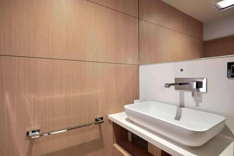 Slide: The Image of Modern bathroom with sleek sink and wooden paneling in Privilege Signature 580, 2025 model. - 47