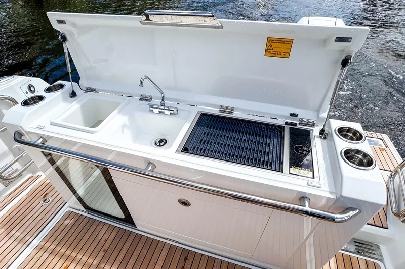 Slide: The Image of Outdoor kitchen on 2025 Wellcraft 38 Explorer yacht with sink and grill. - 13