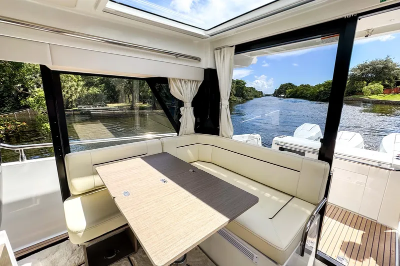 Slide: The Image of Interior of 2025 Wellcraft 38 Explorer yacht with river view and seating area. - 21