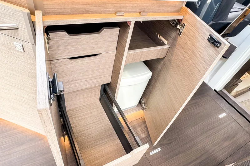 Slide: The Image of Interior storage compartments of 2025 Wellcraft 38 Explorer boat, featuring modern cabinetry and efficient design. - 29
