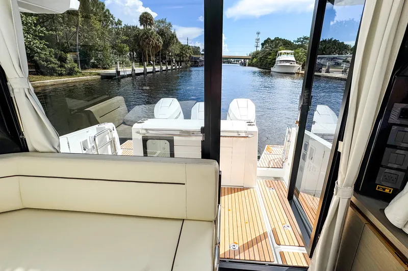 Slide: The Image of Interior view of 2025 Wellcraft 38 Explorer yacht with open deck and scenic waterway. - 19