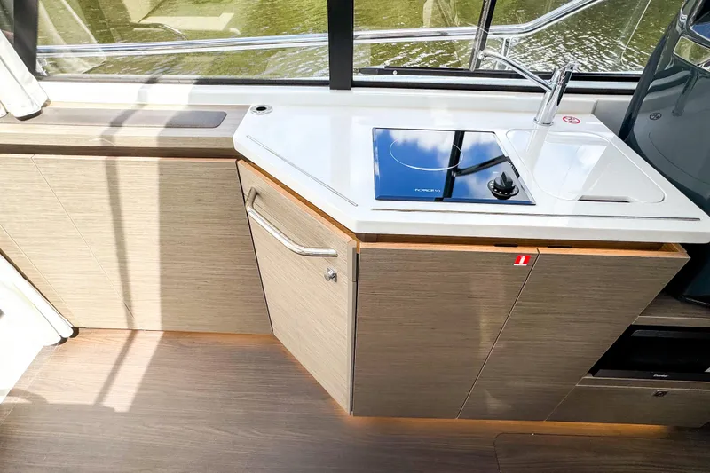 Slide: The Image of 2025 Wellcraft 38 Explorer yacht kitchen with modern sink and stovetop. - 22