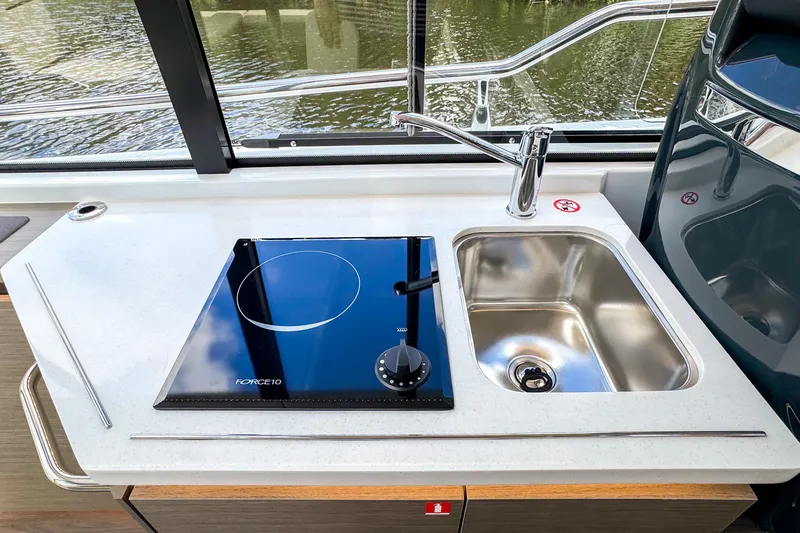 Slide: The Image of Modern kitchen area on 2025 Wellcraft 38 Explorer yacht with stove and sink. - 23