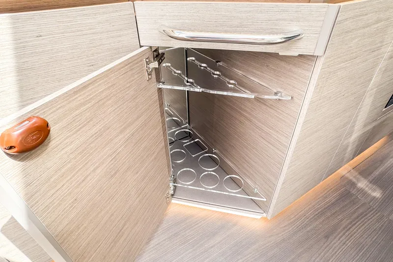 Slide: The Image of 2025 Wellcraft 38 Explorer interior cabinet with wine rack and modern design. - 27