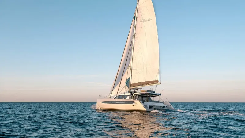 Slide: The Image of Luxury Privilege Signature 580 catamaran sailing on open sea, 2025 model. - 4