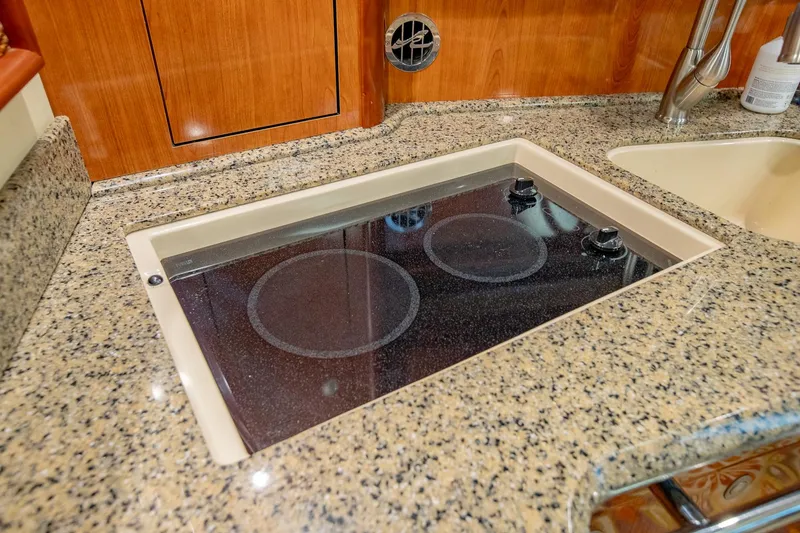 Slide: The Image of Granite countertop with built-in stove on 2005 Sea Ray 420 Sundancer yacht. - 20