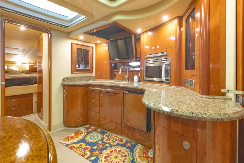 Slide: The Image of Luxurious 2005 Sea Ray 420 Sundancer yacht interior with modern kitchen amenities. - 22