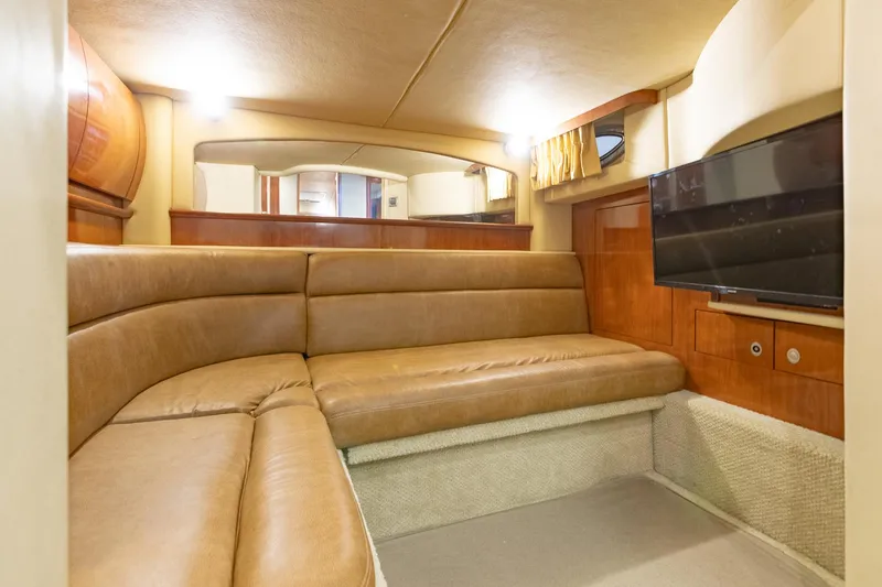 Slide: The Image of Luxurious interior of 2005 Sea Ray 420 Sundancer with leather seating and flat-screen TV. - 23