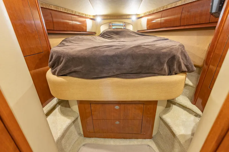 Slide: The Image of Luxurious cabin interior of 2005 Sea Ray 420 Sundancer yacht with cozy bed. - 26