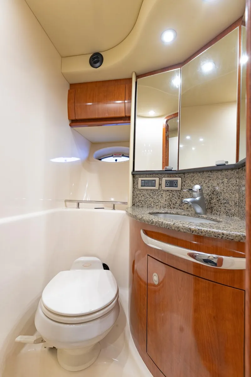 Slide: The Image of Luxurious bathroom in 2005 Sea Ray 420 Sundancer yacht with wood cabinetry and modern fixtures. - 27