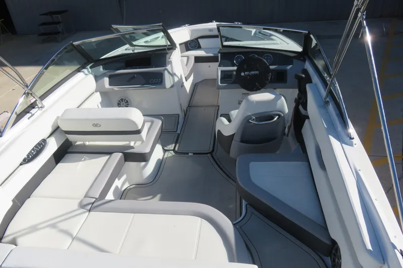 Slide: The Image of 2023 Cobalt CS22 boat interior with sleek seating and modern dashboard design. - 4