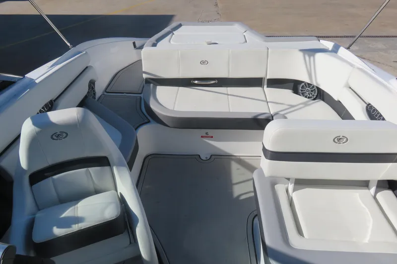 Slide: The Image of 2023 Cobalt CS22 boat interior with white seating and modern design. - 7
