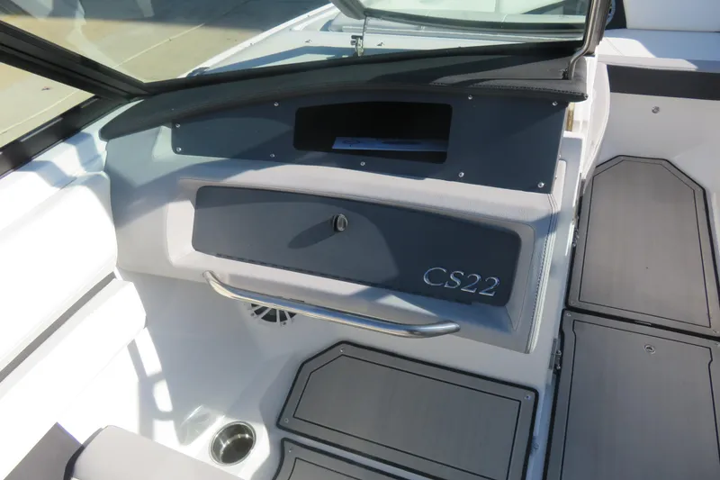 Slide: The Image of 2023 Cobalt CS22 boat interior with sleek dashboard and storage compartment. - 8