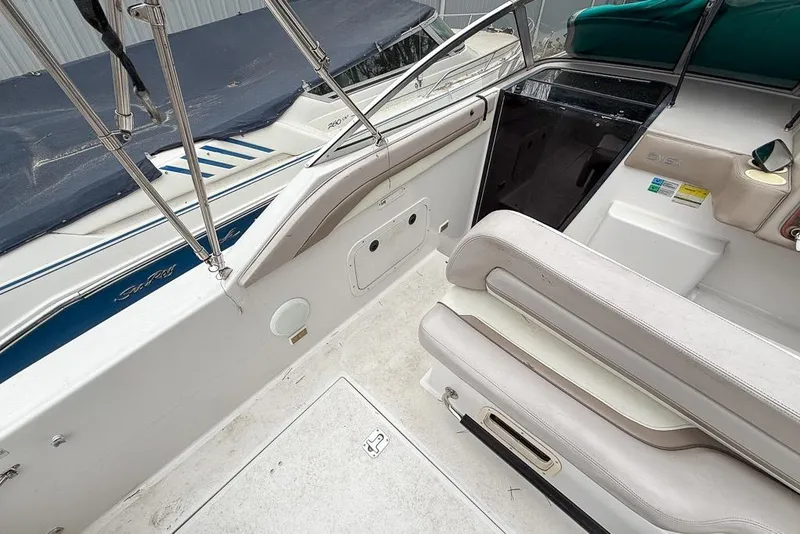 Slide: The Image of 1997 Four Winns 238 Vista boat interior with seating and cockpit area. - 15