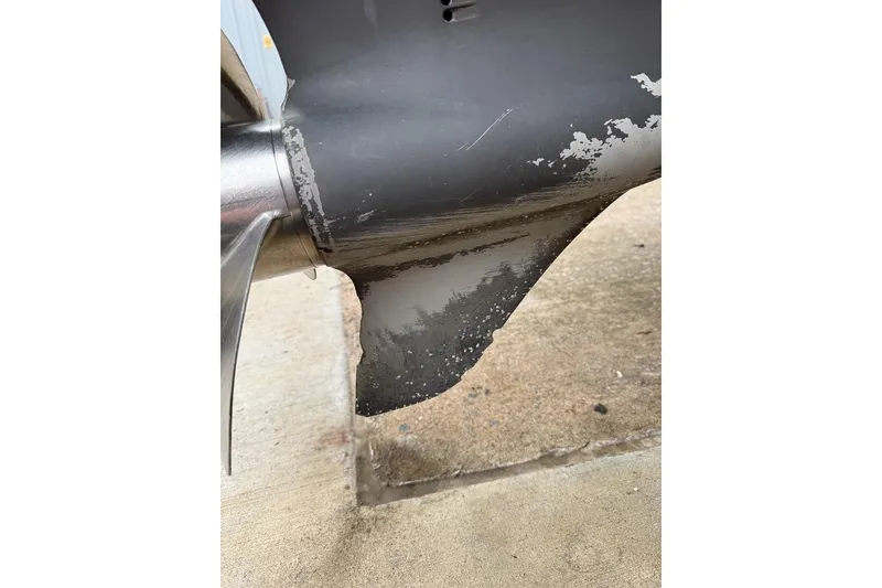 Slide: The Image of Close-up of a worn propeller on a 1997 Four Winns 238 Vista boat. - 21