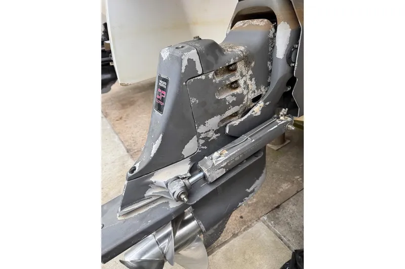 Slide: The Image of 1997 Four Winns 238 Vista boat engine with visible wear and corrosion. - 22