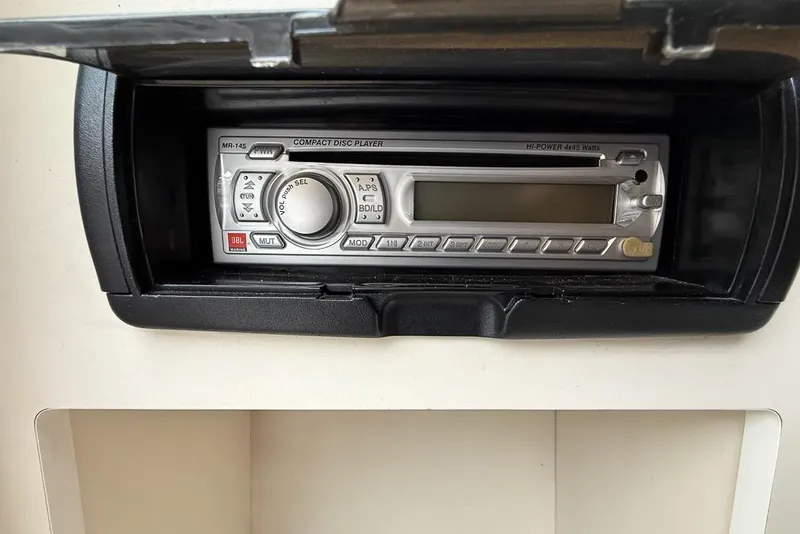 Slide: The Image of 1997 Four Winns 238 Vista boat stereo system with compact disc player. - 23