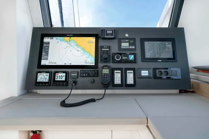 Slide: The Image of Control panel of 2025 Privilege Signature 580 yacht with navigation and communication systems. - 43