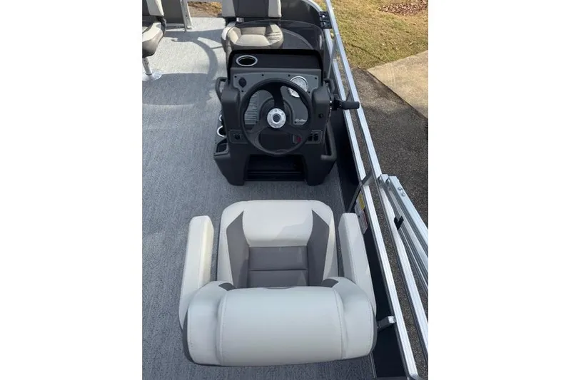 Slide: The Image of 2026 Sun Tracker Bass Buggy 16 XL Select boat interior with steering console and seating. - 10