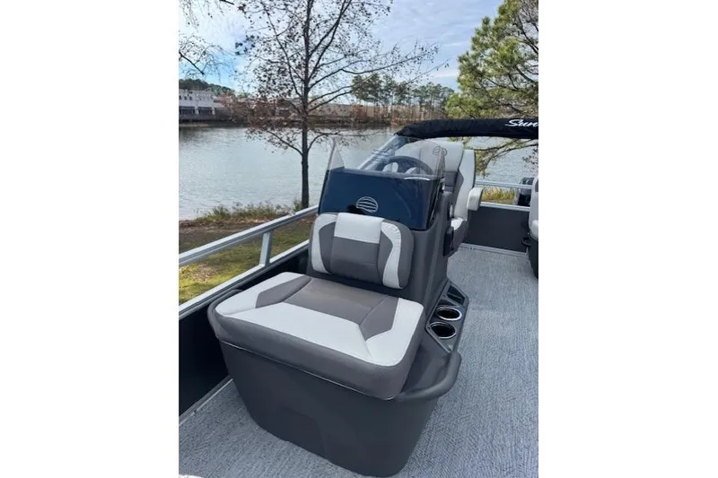Slide: The Image of 2026 Sun Tracker Bass Buggy 16 XL Select pontoon boat interior with seating and console. - 11