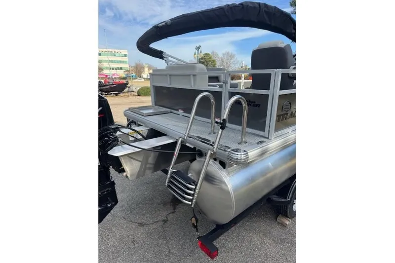 Slide: The Image of 2026 Sun Tracker Bass Buggy 16 XL Select pontoon boat with ladder and seating. - 13