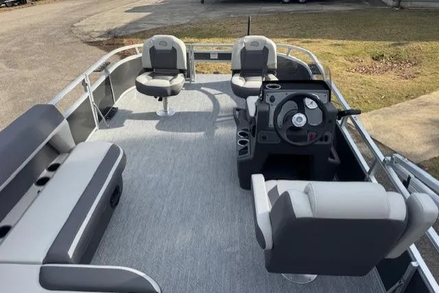 Slide: The Image of 2026 Sun Tracker Bass Buggy 16 XL Select pontoon boat interior with seating and steering console. - 7