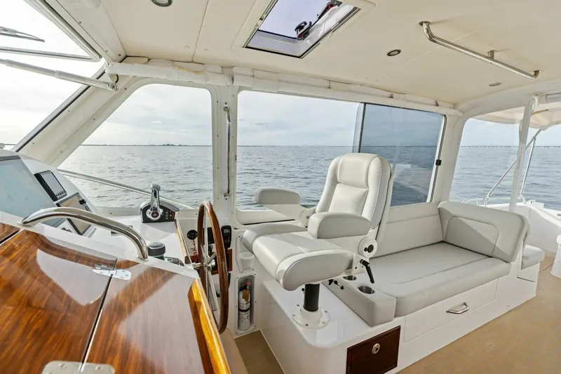 Slide: The Image of Luxurious interior of 2025 MJM 35 yacht with plush seating and ocean view. - 16