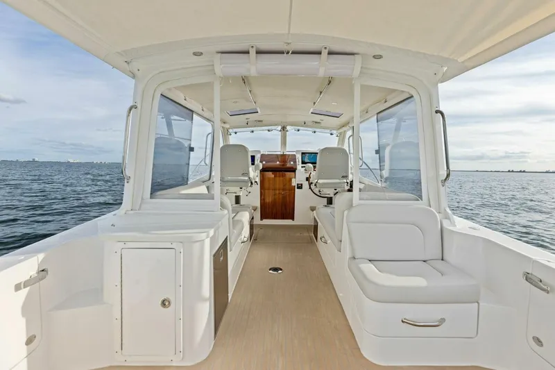 Slide: The Image of Luxurious 2025 MJM 35 boat interior with sleek seating and ocean view. - 2