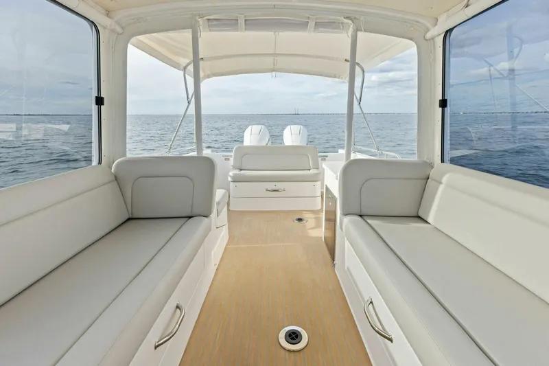 Slide: The Image of Interior view of 2025 MJM 35 boat with spacious seating and ocean backdrop. - 21