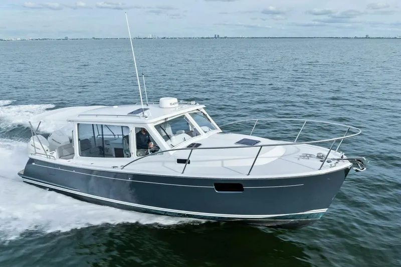 Slide: The Image of 2025 MJM 35 boat cruising on open water, showcasing sleek design and modern features. - 50